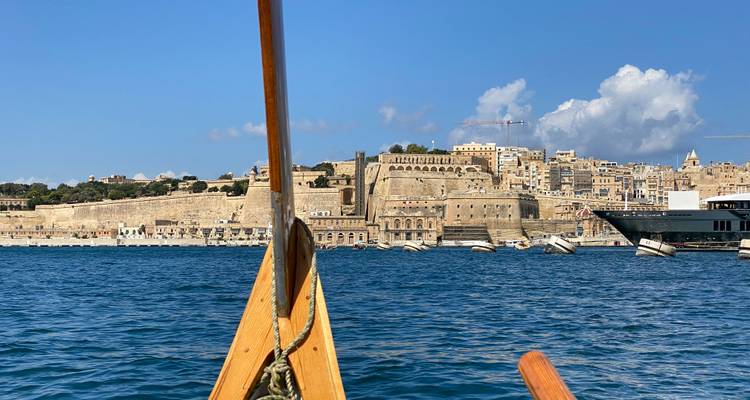Boat ride view towards a fortified Maltese town.