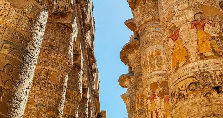 Detailed view of ancient stone columns with engraved hieroglyphs.