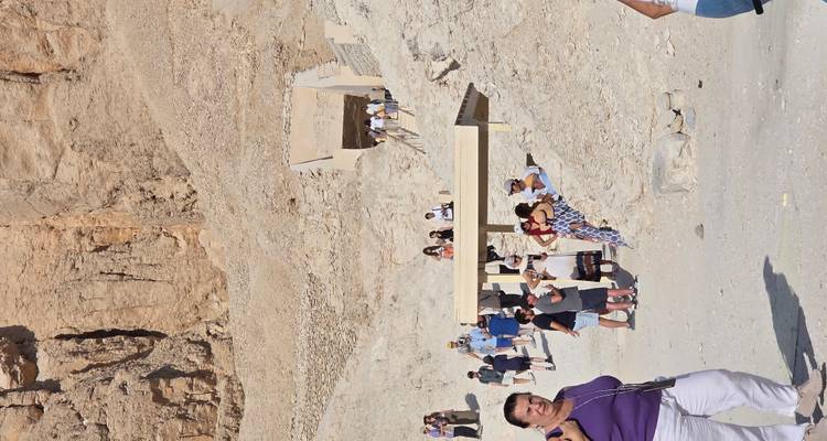 Tourists at the entrance to an ancient tomb complex.