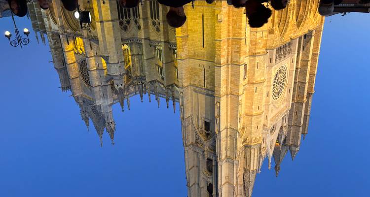 Illuminated cathedral against a night sky.