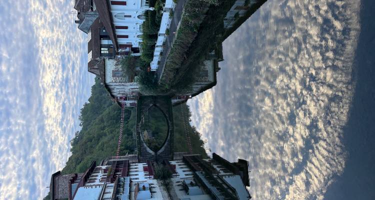 Reflections of buildings and bridge on a river.