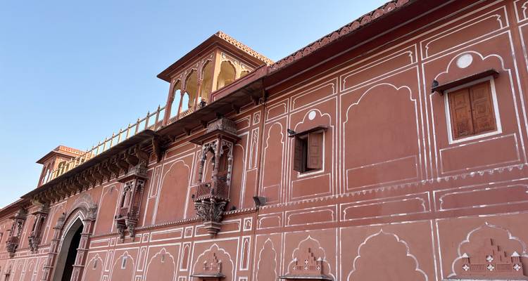 Red sandstone building with intricate detailing.