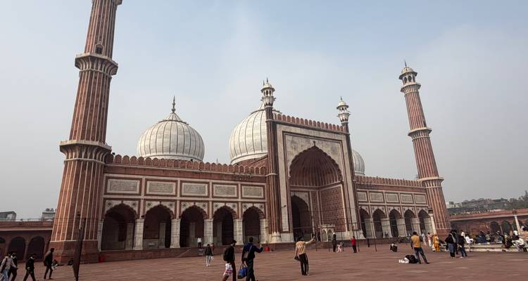 Jama Masjid in New Delhi with visitors in the courtyard.