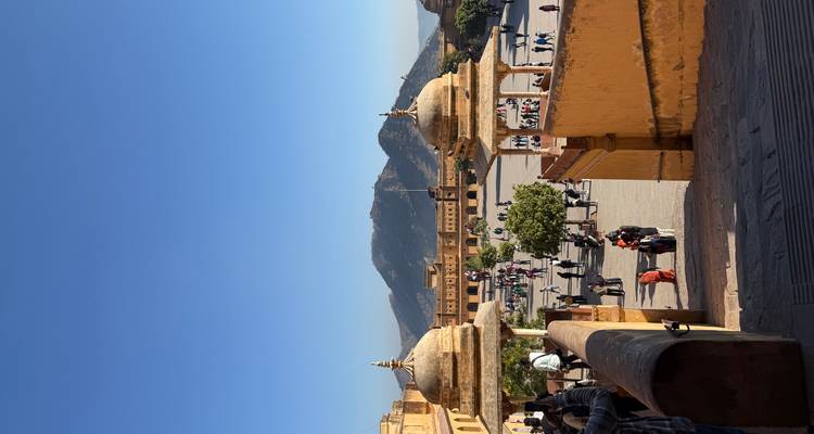 Amber Fort with people and mountains in the background
