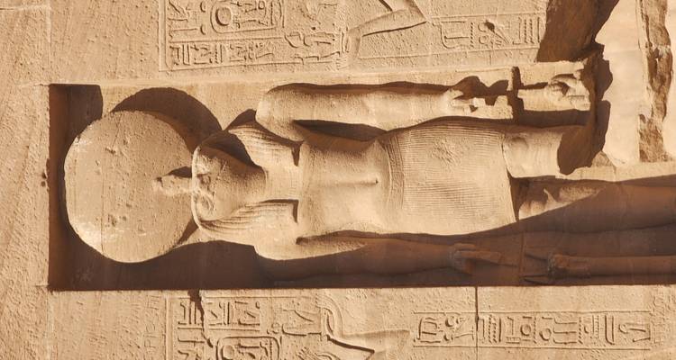 Ancient Egyptian wall carvings with hieroglyphs and figures.