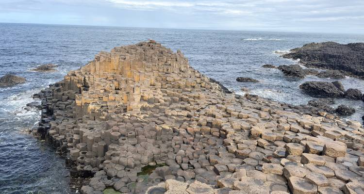 Panoramic view of Giant’s Causeway’s interlocking basalt columns stretching into the sea