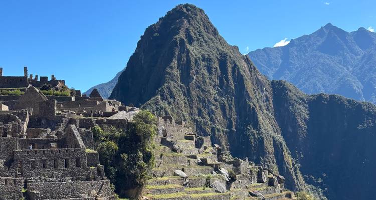 Classic view of Machu Picchu ruins with Huayna Picchu mountain dominating the scene.