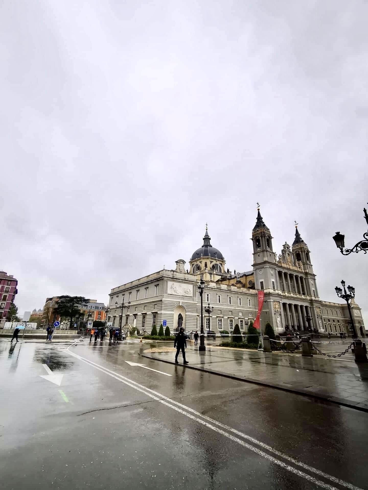 A grand cathedral with intricate architectural details in a public square.