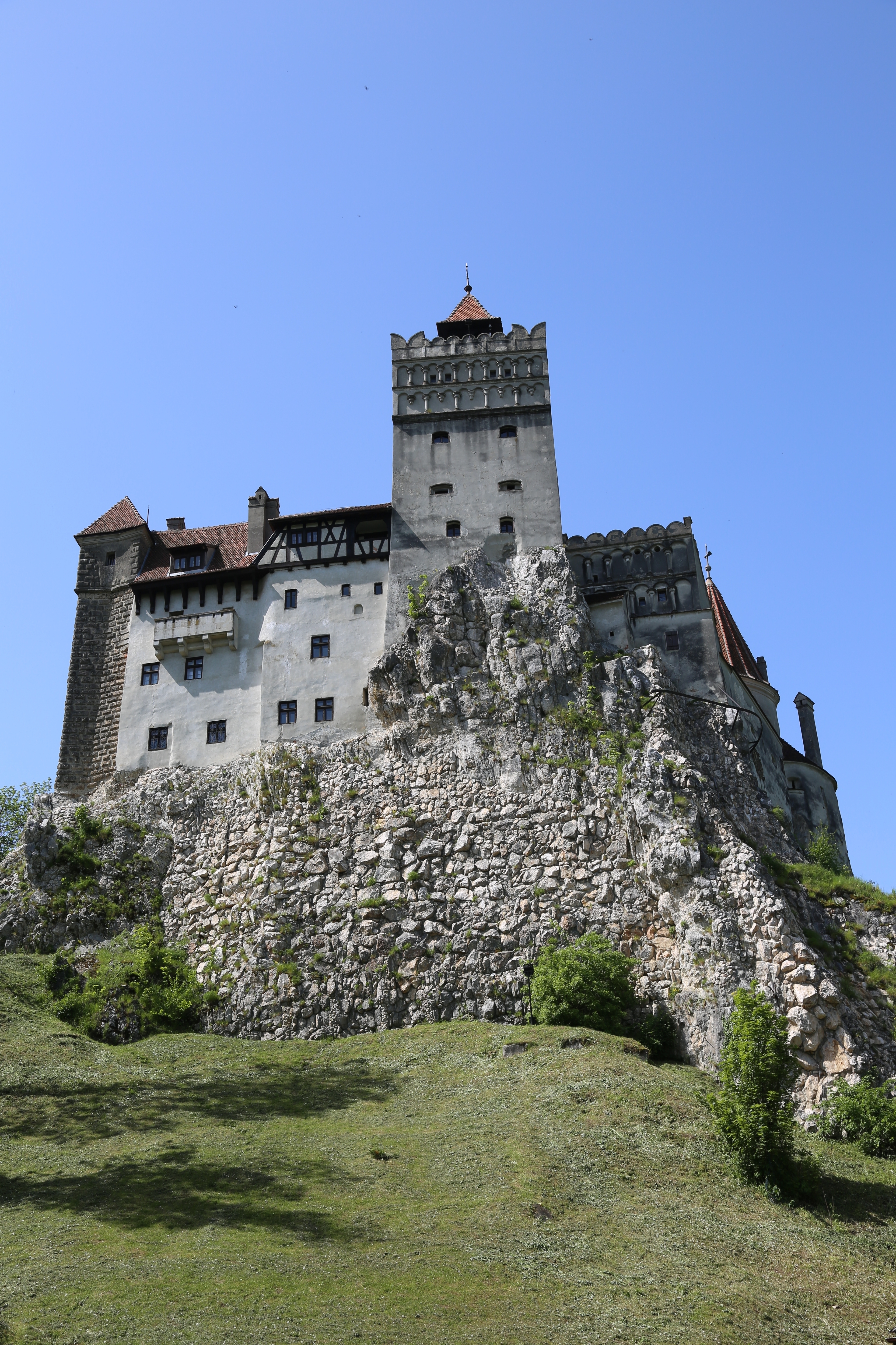 Bran Castle, an iconic fortress on a rocky hill.