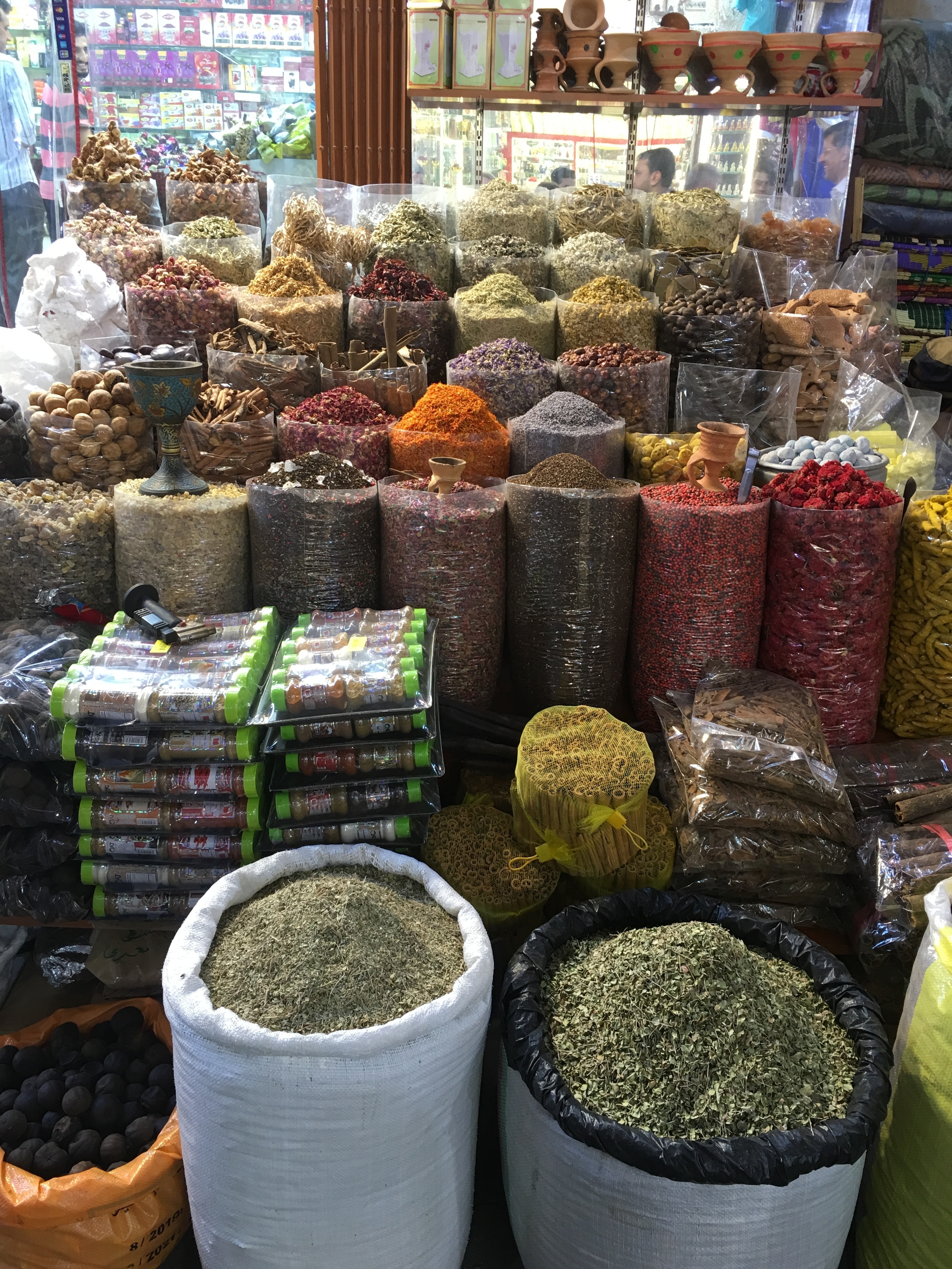 A market stall with various spices and condiments in display.