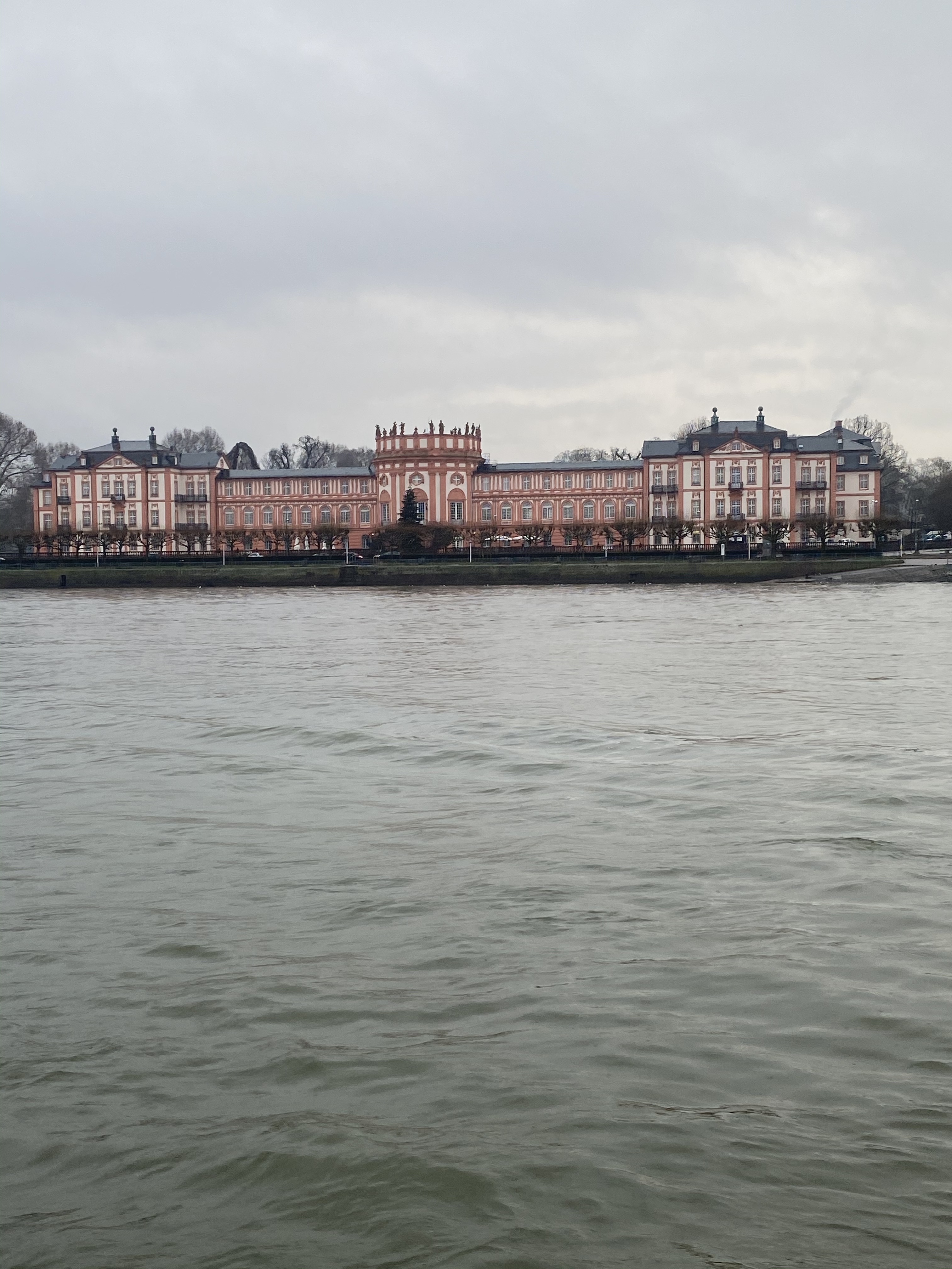Large building with river in the foreground.