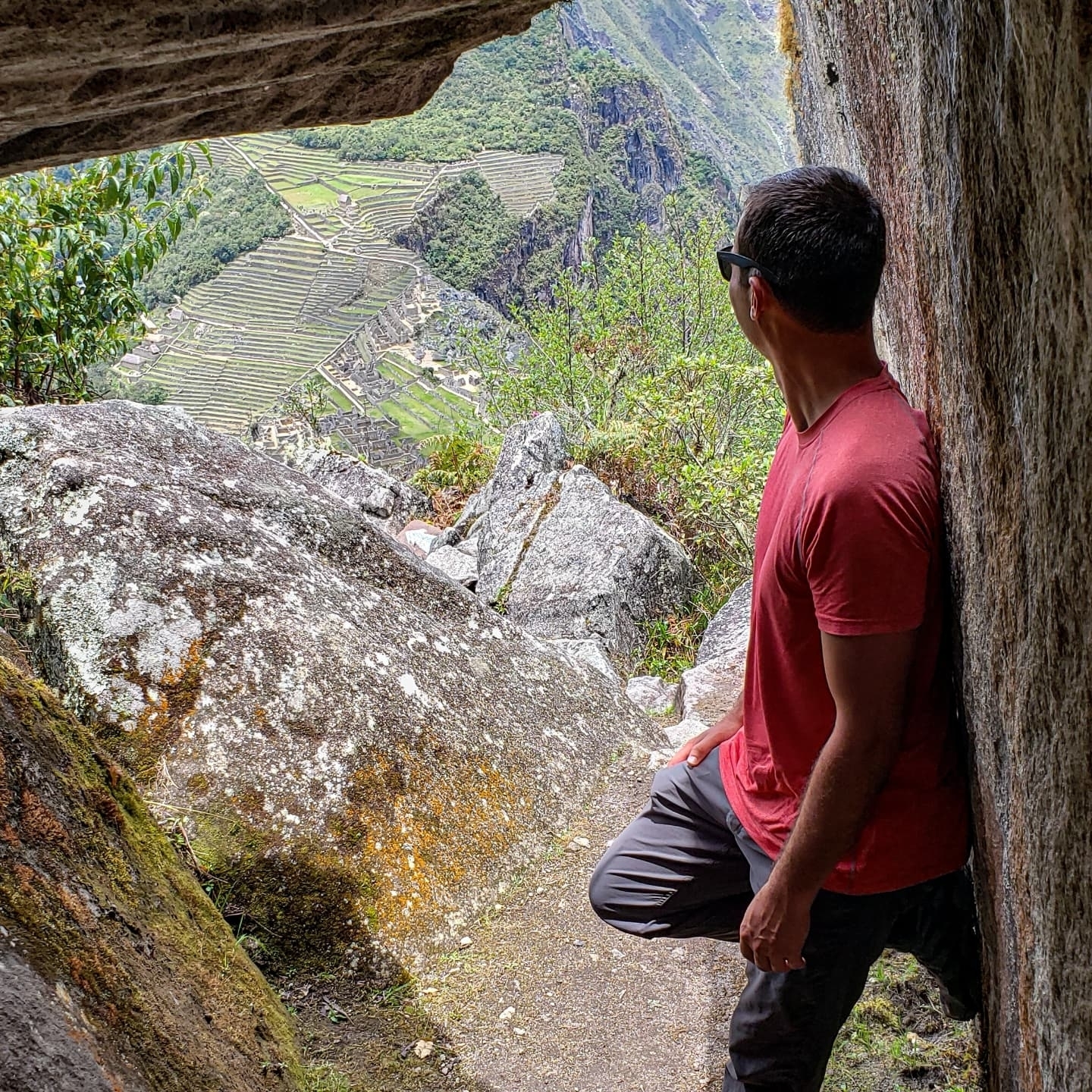Man looking at Machu Picchu from a viewpoint.