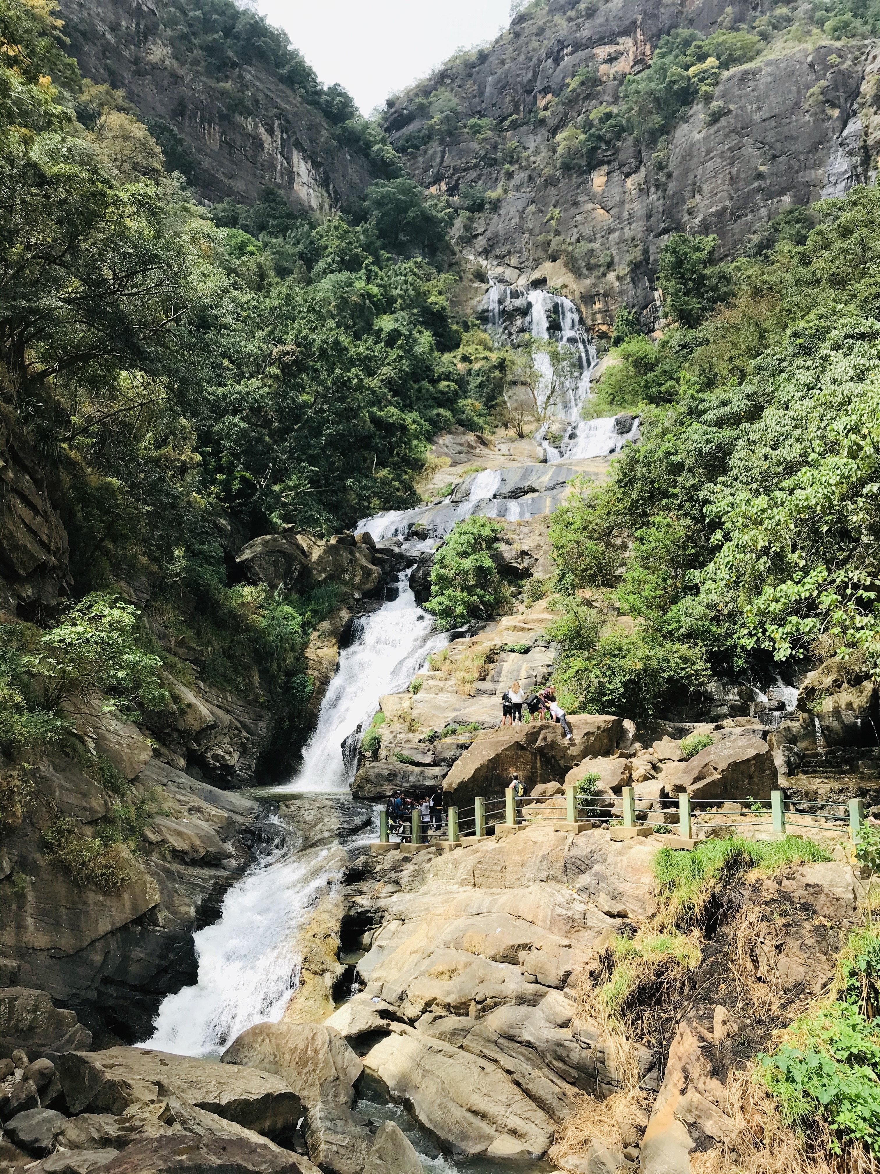 Waterfall with people at the base.
