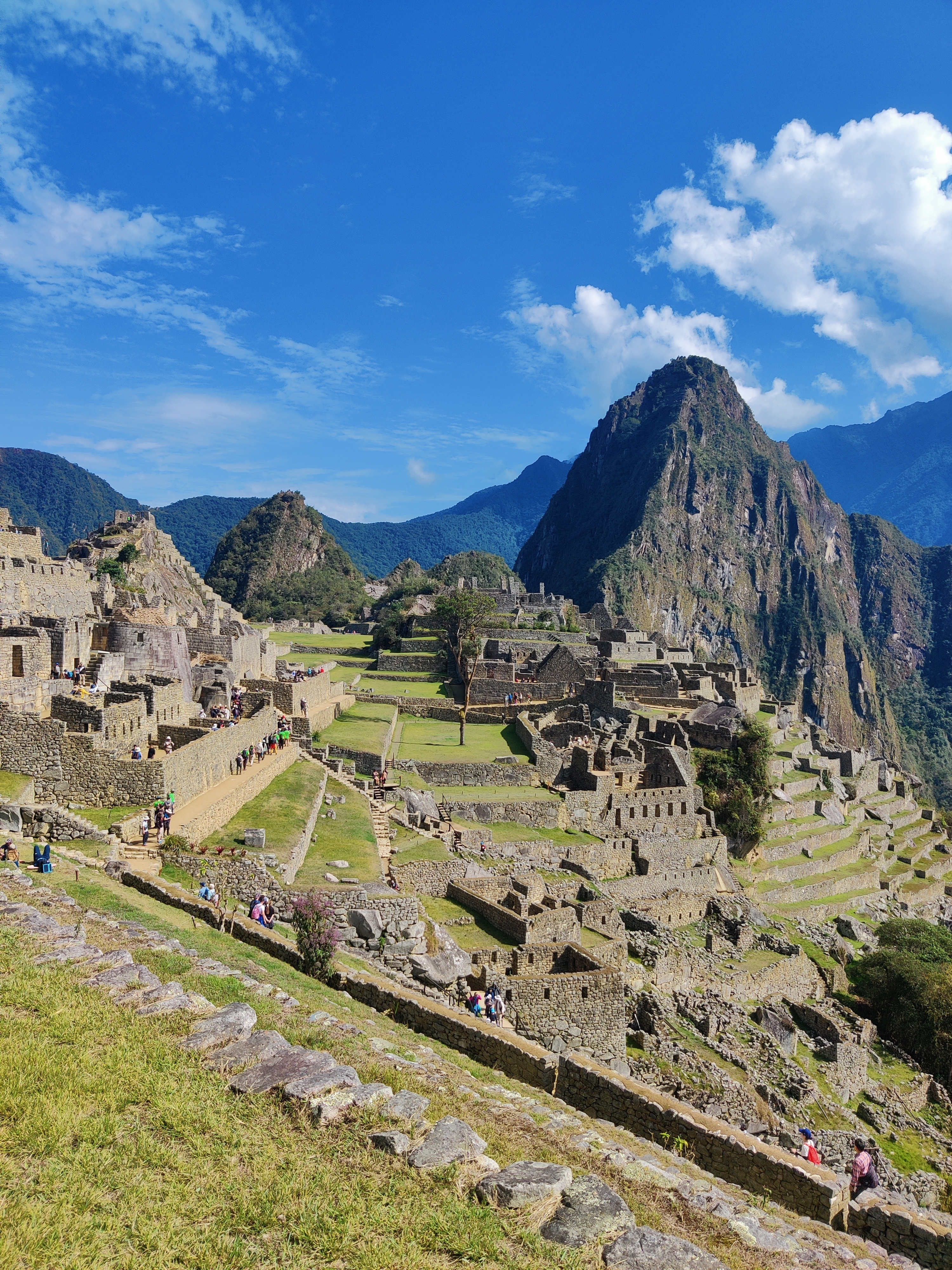 Machu Picchu ruins with mountain backdrop.