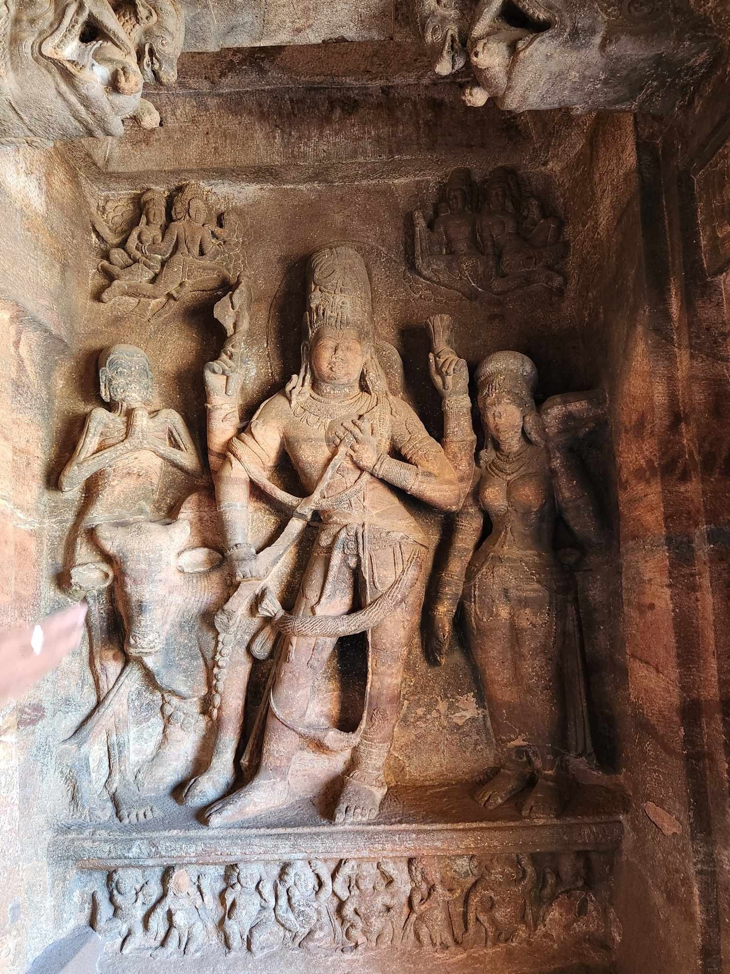 Ancient rock carvings depicting deities and figures.