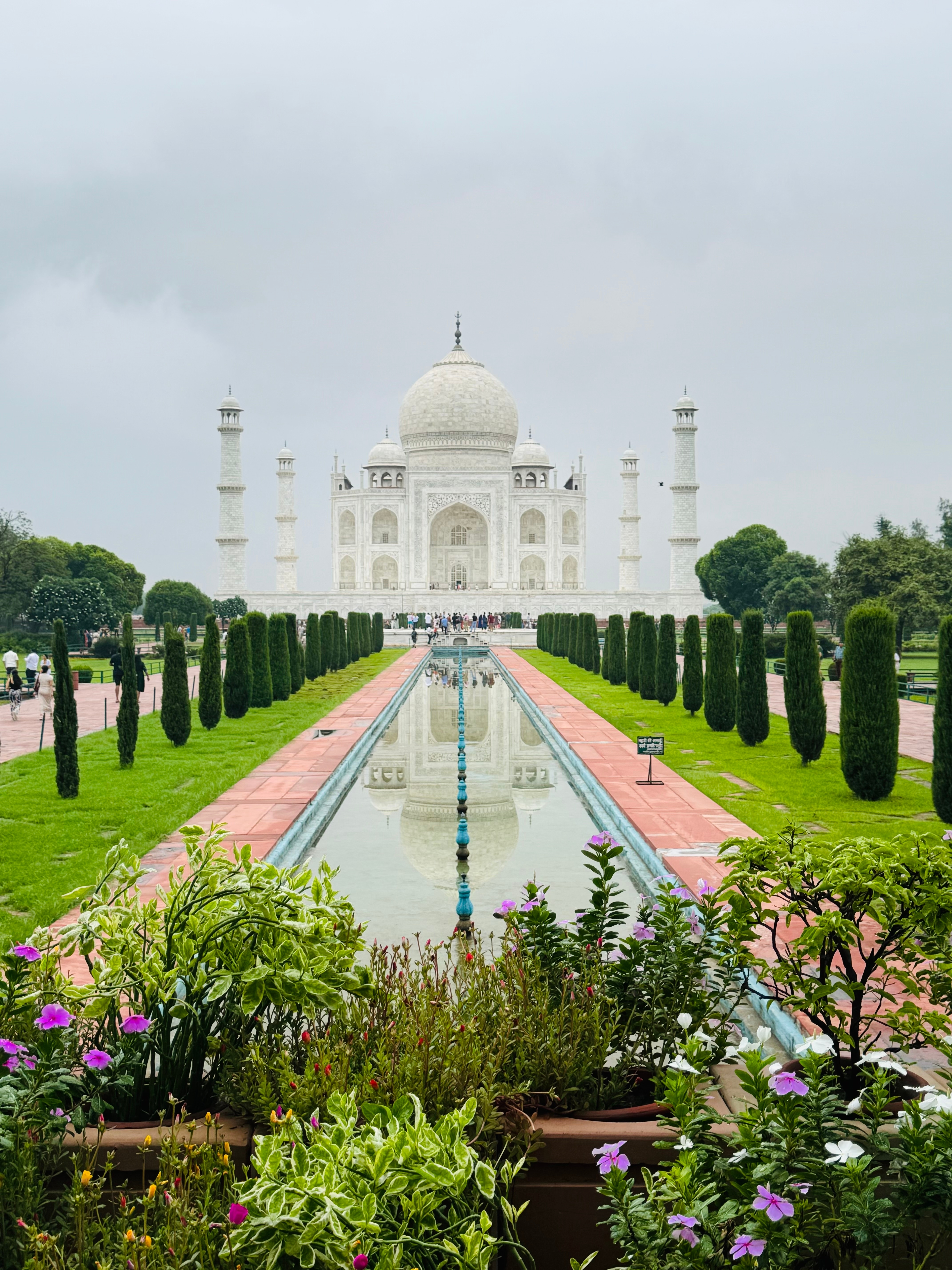 The iconic view of the Taj Mahal with its reflection in the water.