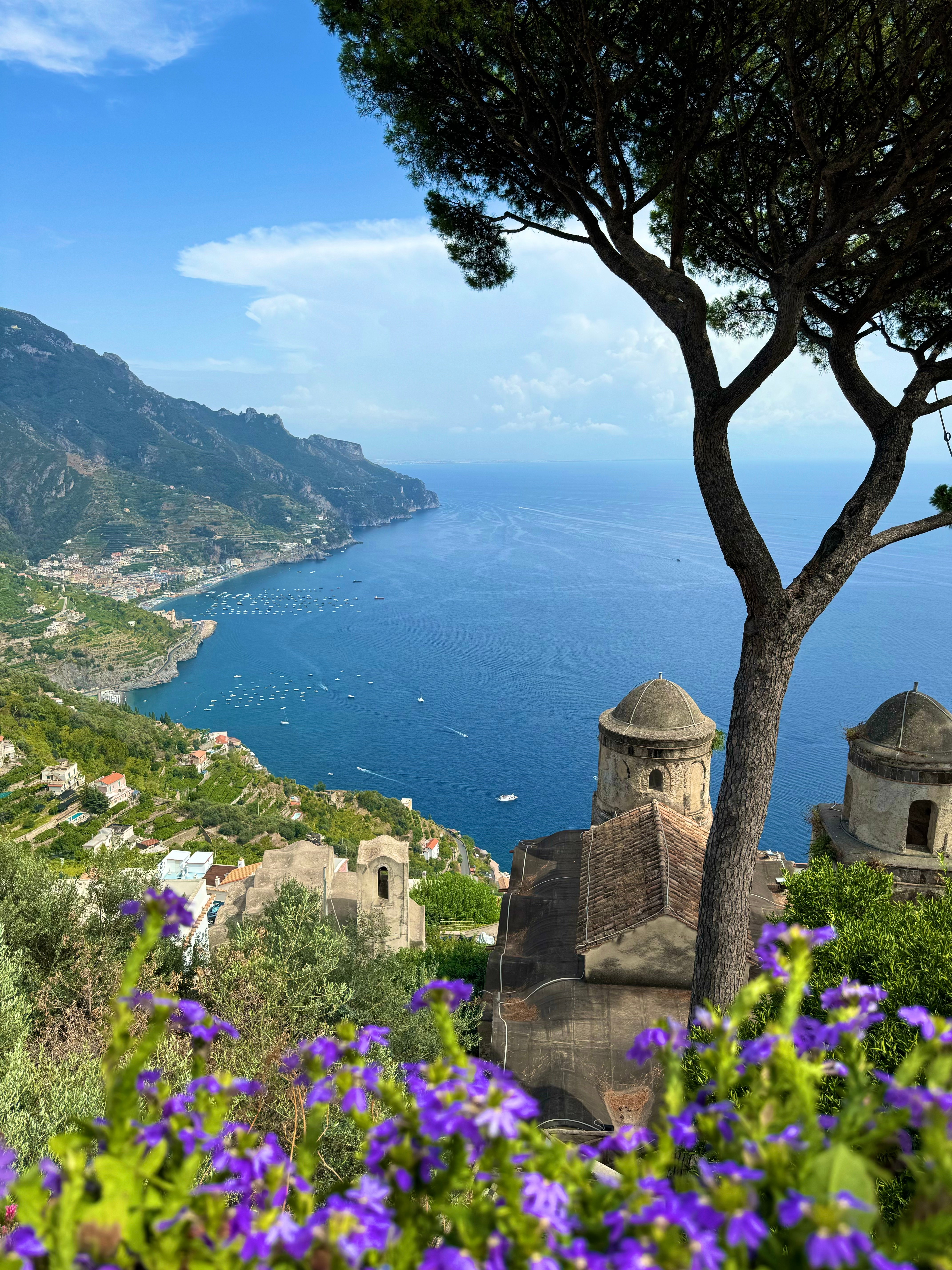 Scenic coastal view with cliffs and villages.