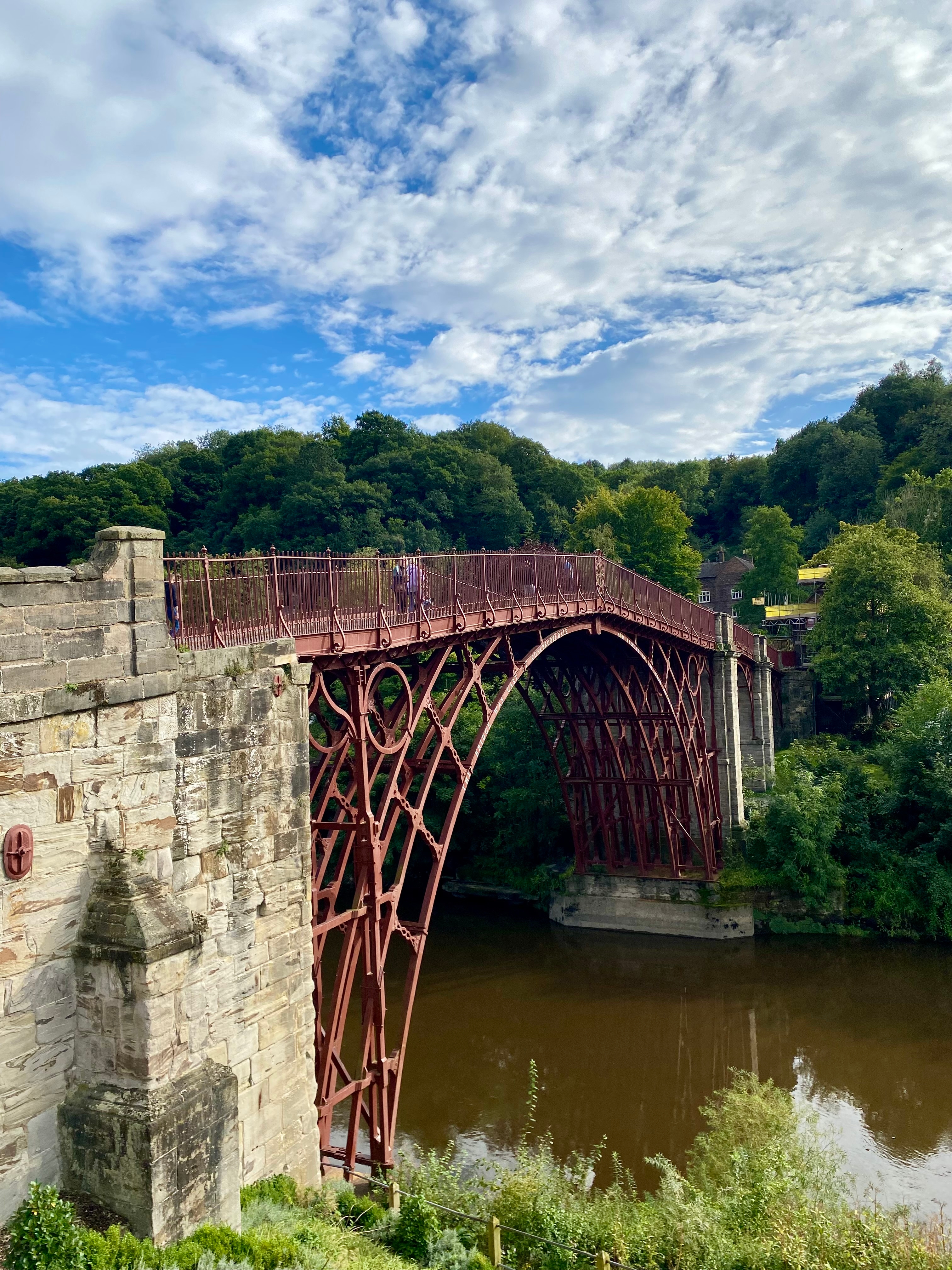Historic iron bridge over a river.