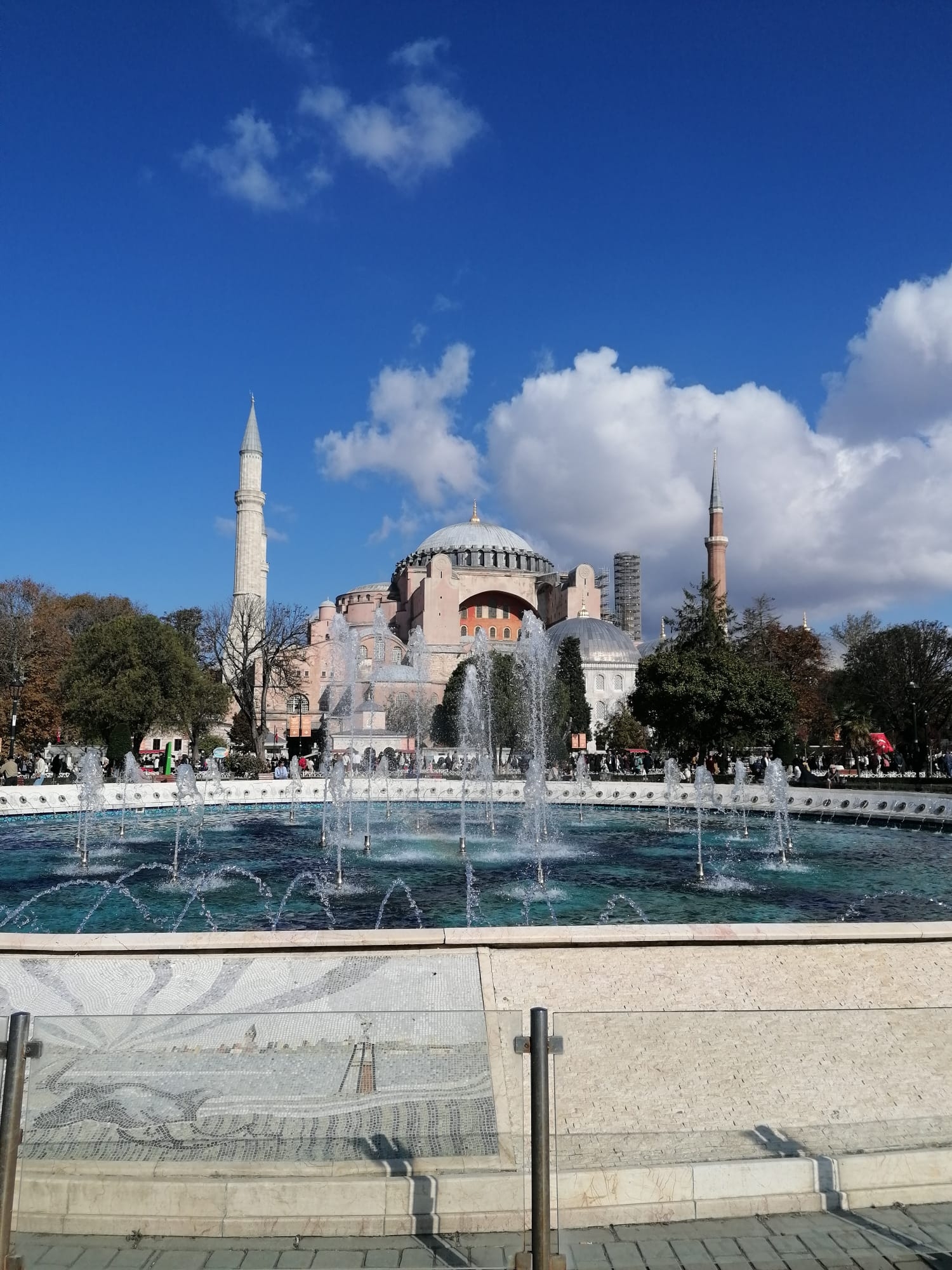 Fountain in front of the magnificent Hagia Sophia under a clear sky.
