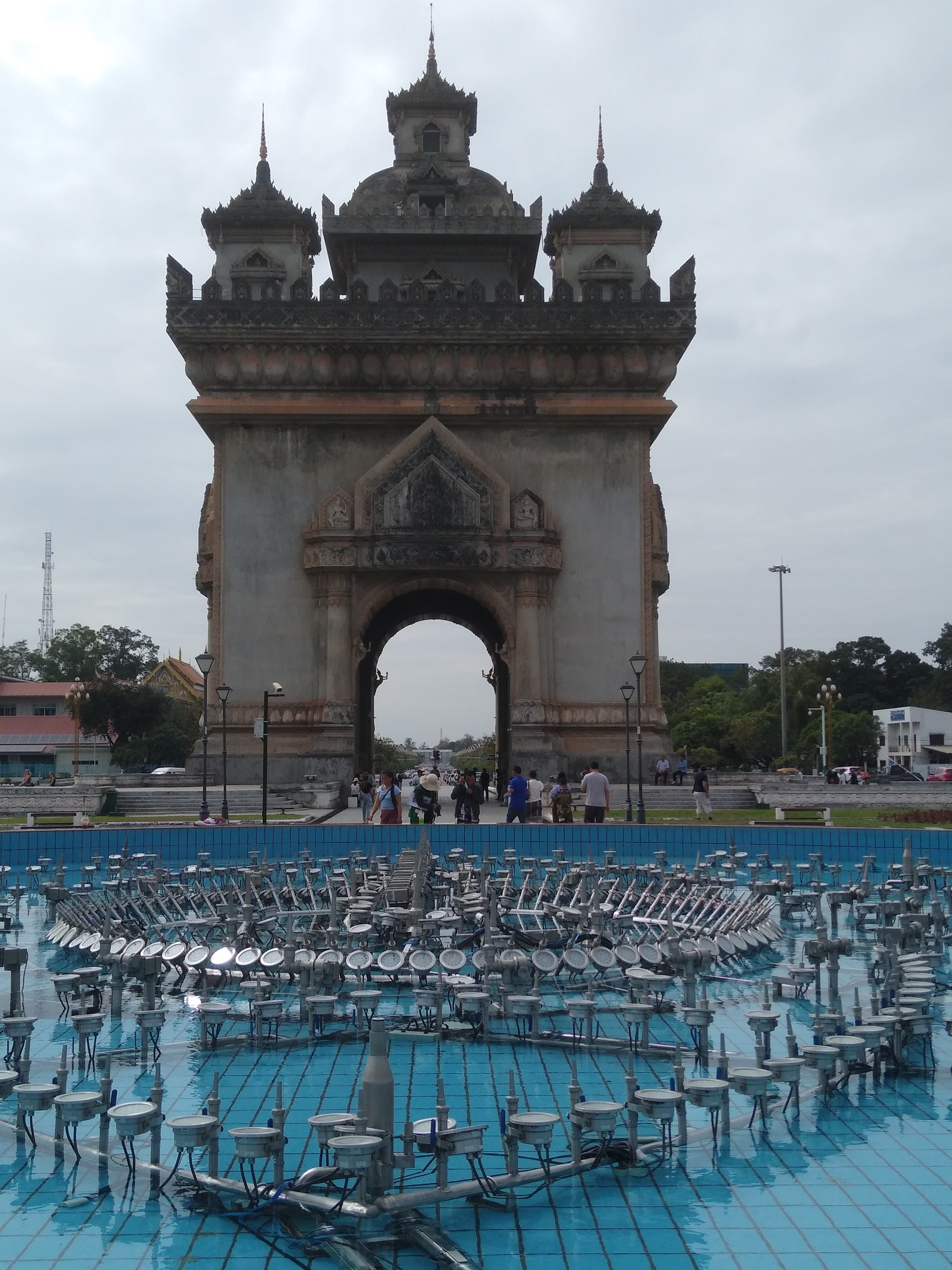 Arch structure with people walking through it.