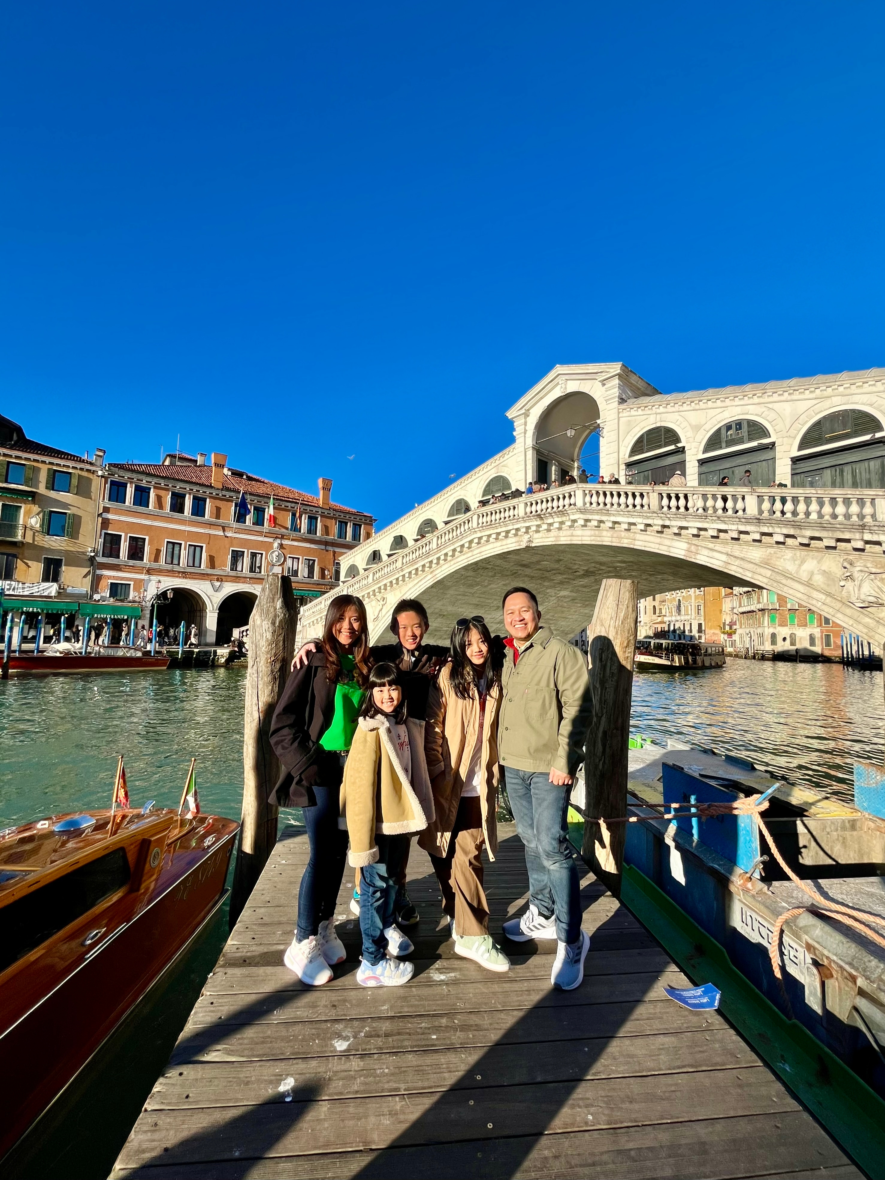Group posing in front of the Rialto Bridge.