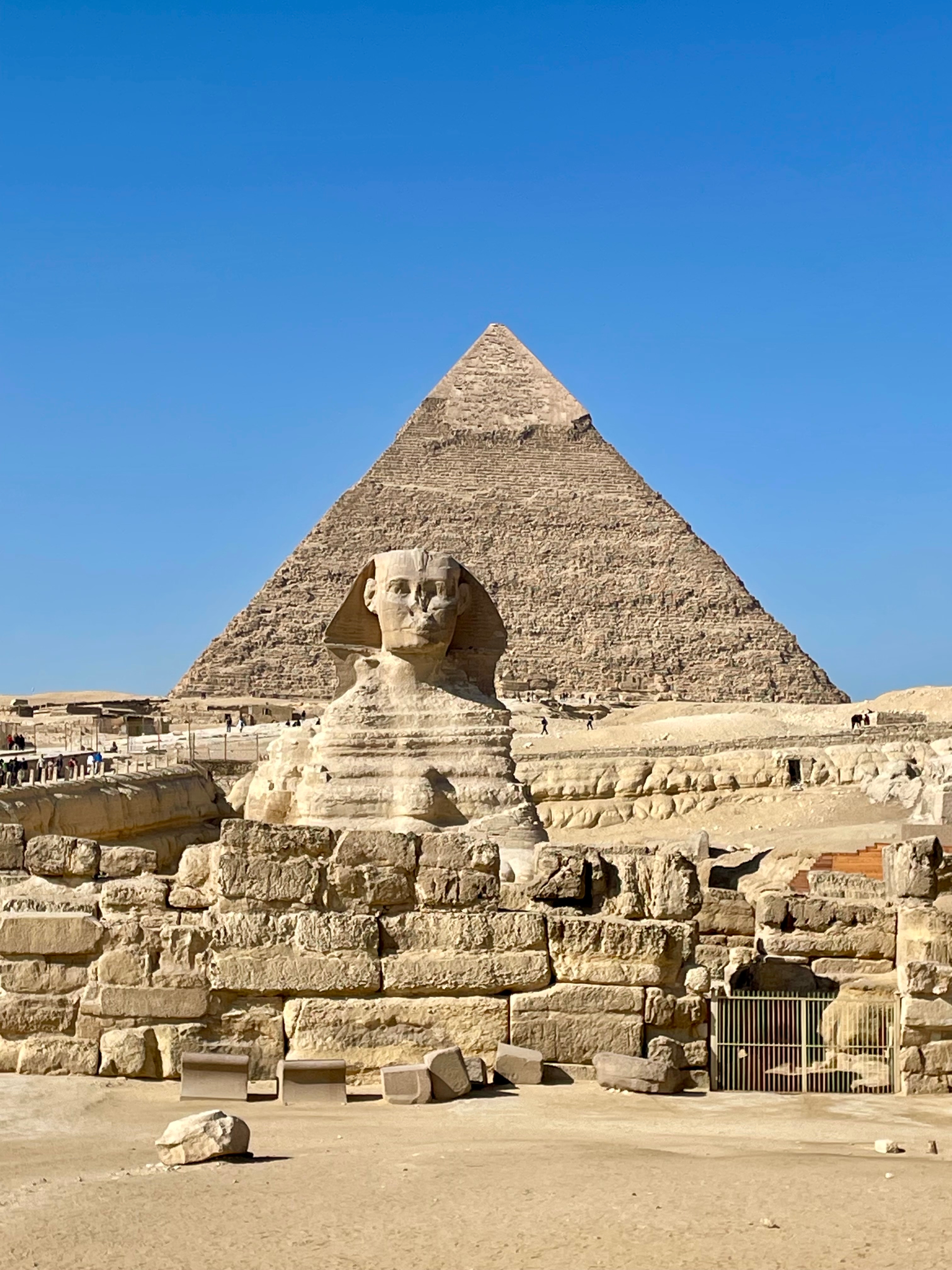 The Sphinx and Great Pyramid in Giza on a sunny day.