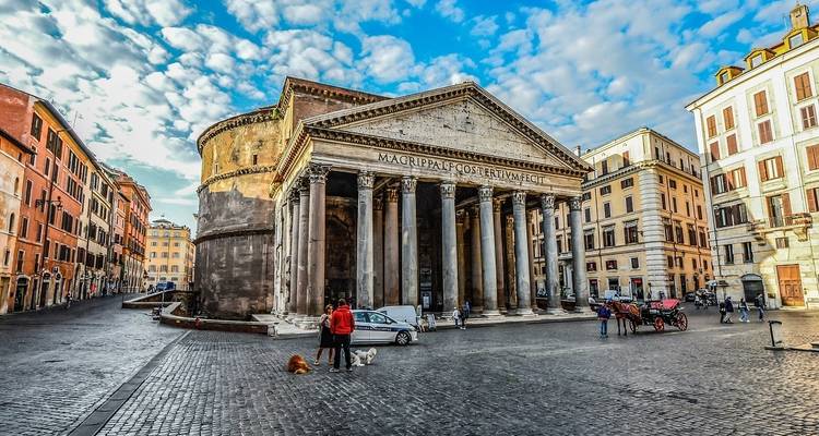 The Pantheon dominates a lively cobblestone square filled with locals and pets.