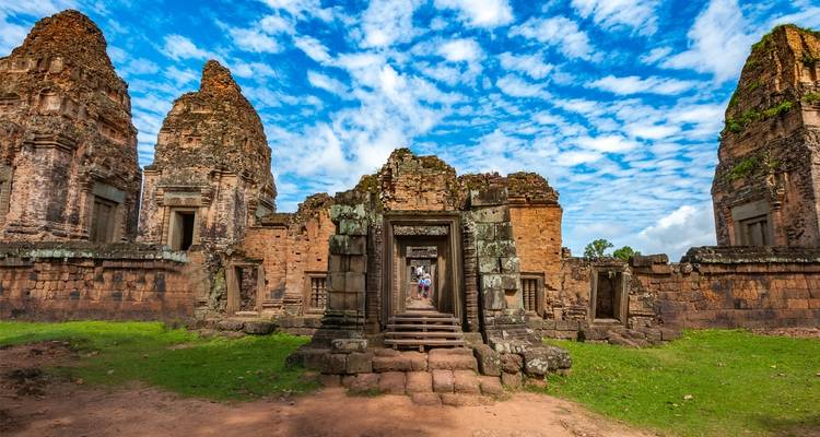 Entrance of an ancient temple in a vibrant setting.
