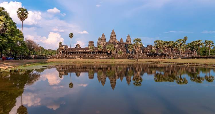 Angkor Wat temple with reflection in water.