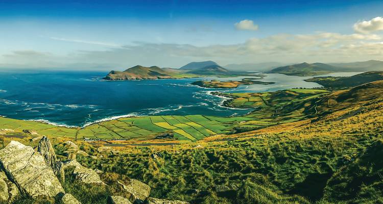 Sweeping coastal patchwork of green fields and bays along Ireland’s Ring of Kerry