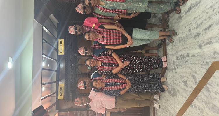 Group of people indoors with traditional checks.