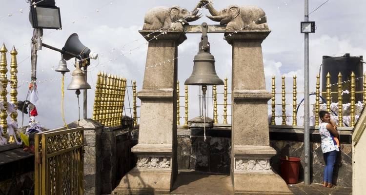 Bell and elephants sculpture at a temple.