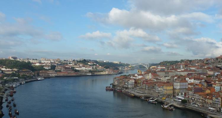View of cityscape by the river with bridges connecting the towns.