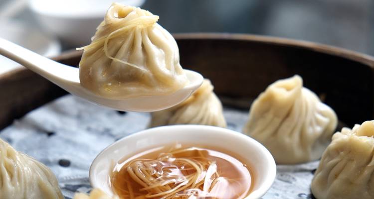 Chinese dumplings with dipping sauce.