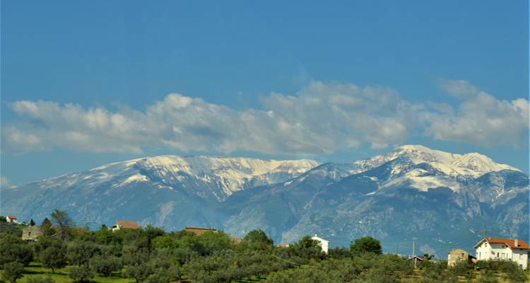 Snow-capped mountains under a clear blue sky.