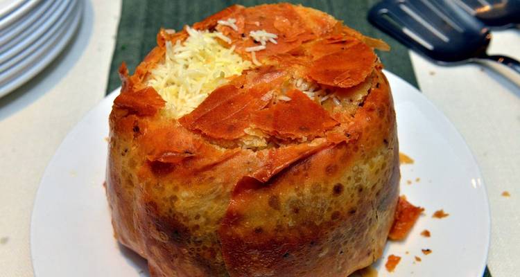 Traditional layered rice dish with crispy crust.