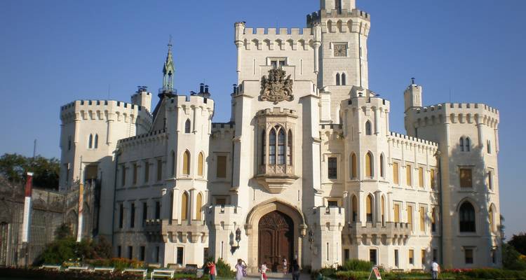 Hluboka Castle with a clear blue sky.
