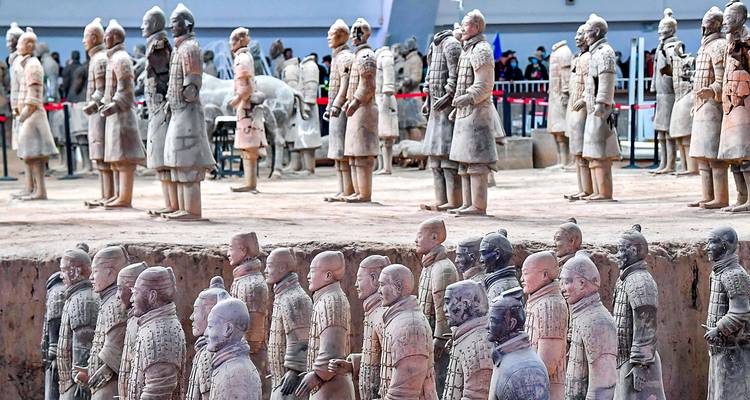 Rows of life-sized Terracotta Warriors stand in the vast excavation pits of Xi’an’s famous army.
