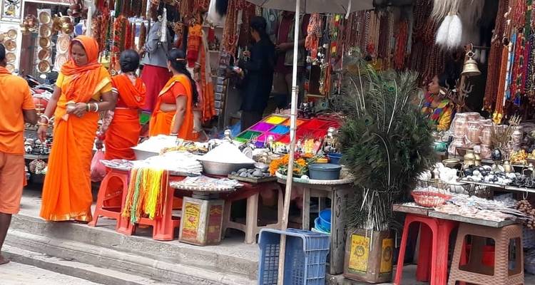 Street market with vendors selling colorful items.