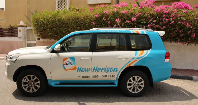 Vehicle with branding parked on a street.