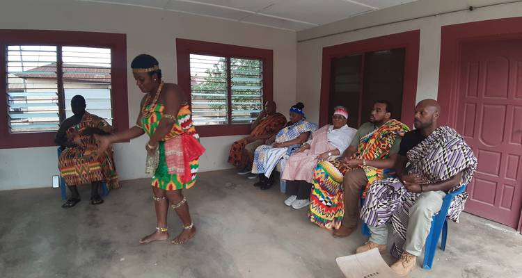 Group watching a cultural dance performance.