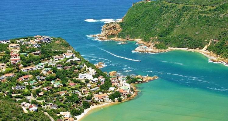Aerial view of a coastal area with turquoise water.