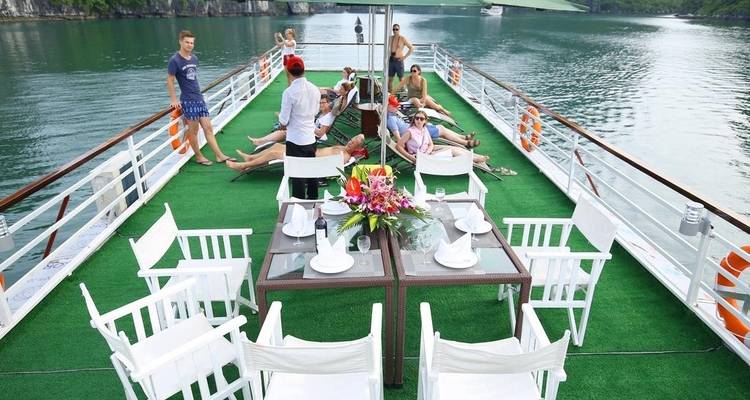 Group of people relaxing on a cruise deck.