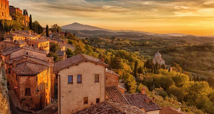 Hilltop town at sunset with a view of the countryside