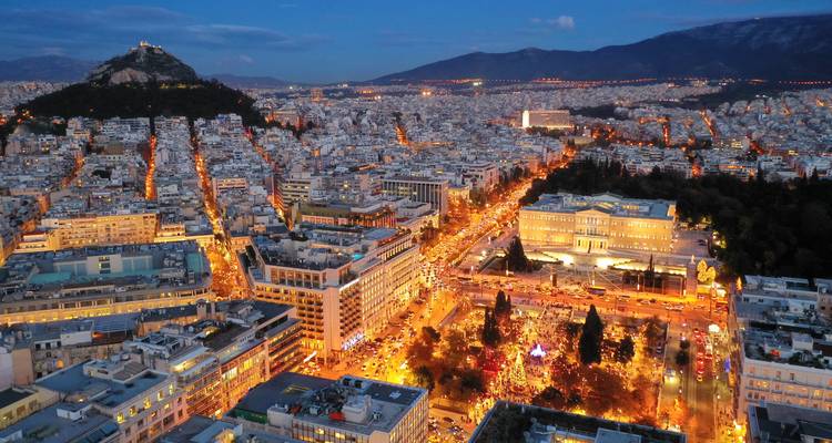 Aerial night view of Athens with illuminated buildings