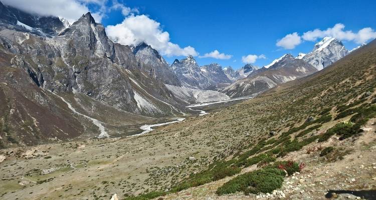 Vast mountain valley with a river winding through it.
