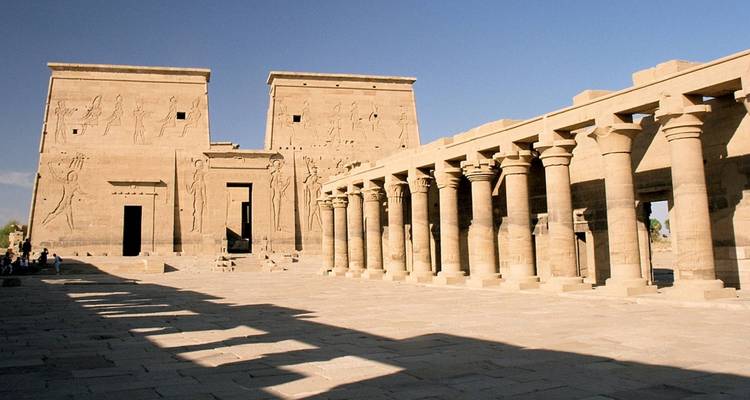 Temple with columns and hieroglyphics basked in sunlight.