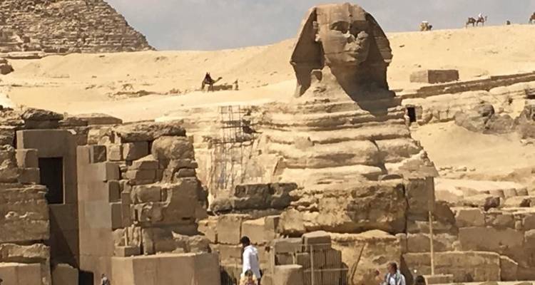 Tourists exploring the area around the Sphinx.