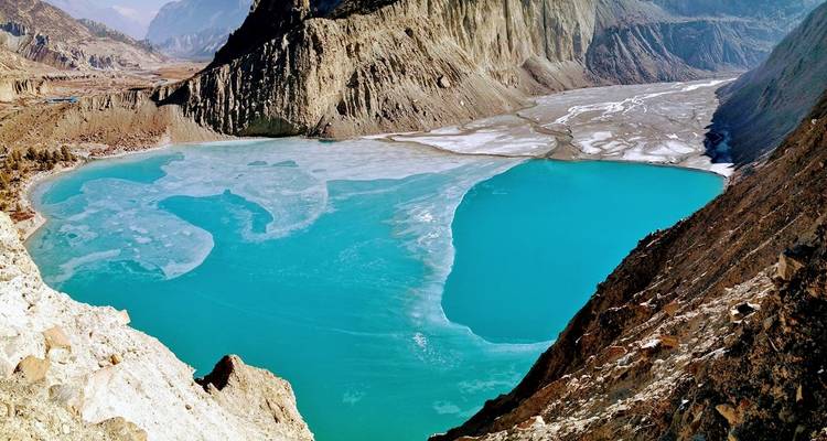 Turquoise lake surrounded by mountains