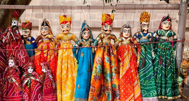 Colorful traditional Rajasthani puppets on display.